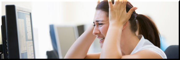 Frustrated person in front of computer screen