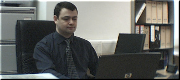 Picture of Guido Gybels at his desk